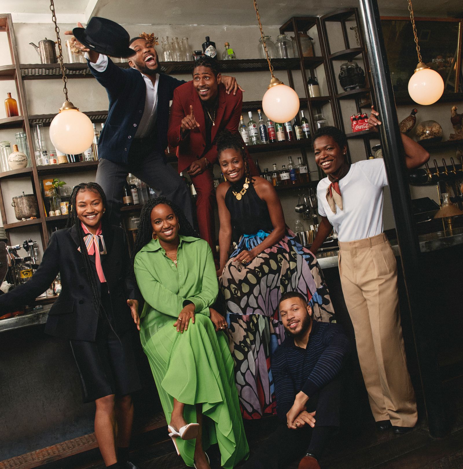 Xavier Scott Evans in a red suit with the On Sugarland creative team and company